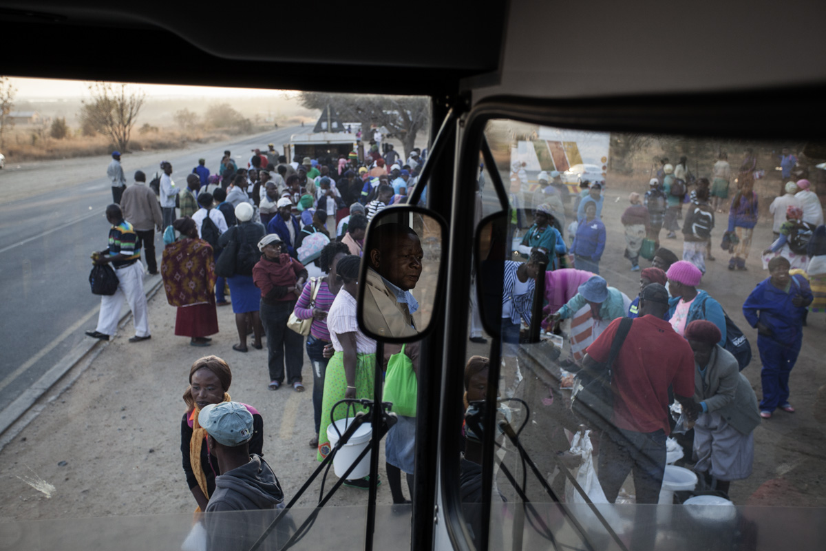 A bus driver waiting for passengers to board.